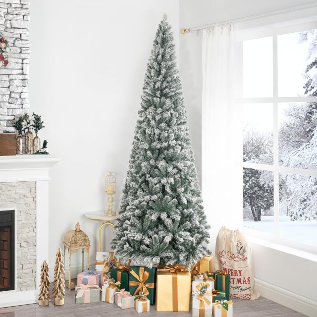 Naomi Home Salzburg 7.5-foot frosted pre-lit slim artificial Christmas tree with lightly flocked branches in a bright holiday living room