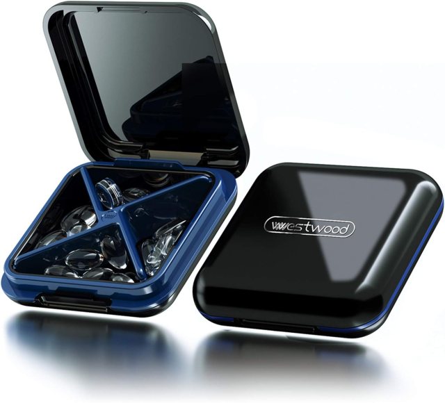 Dubstar waterproof travel pill organizer with four compartments, shown open and closed in glossy black with blue interior dividers for organizing daily medications, vitamins, or small essentials.